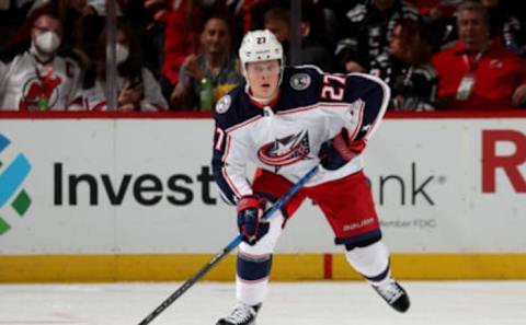 NEWARK, NEW JERSEY – JANUARY 06: Adam Boqvist #27 of the Columbus Blue Jackets takes the puck during the first period against the New Jersey Devils at Prudential Center on January 06, 2022 in Newark, New Jersey. (Photo by Elsa/Getty Images)