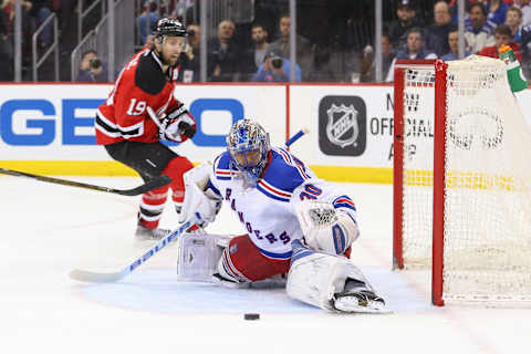 Feb 23, 2016; Newark, NJ, USA; New York Rangers goalie Henrik Lundqvist (30) makes a save during the second period of their game against the New Jersey Devils at Prudential Center. Mandatory Credit: Ed Mulholland-USA TODAY Sports