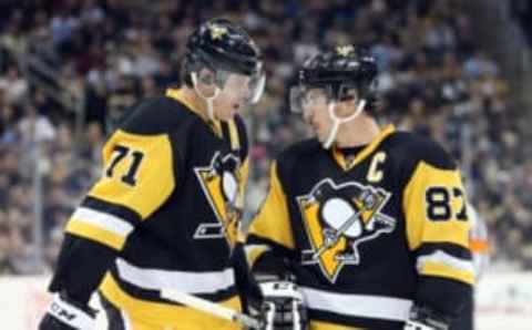 Nov 28, 2015; Pittsburgh, PA, USA; Pittsburgh Penguins center Evgeni Malkin (71) and Sidney Crosby (87) talk on the ice against the Edmonton Oilers during the second period at the CONSOL Energy Center. The Oilers won 3-2 in a shootout. Mandatory Credit: Charles LeClaire-USA TODAY Sports