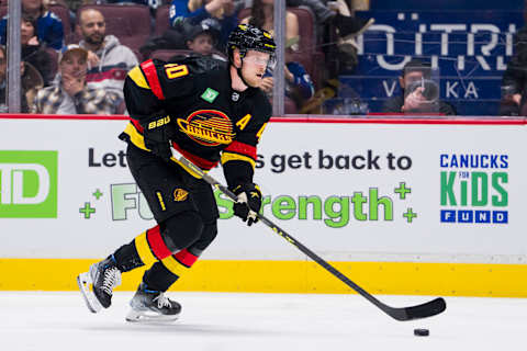 Mar 21, 2023; Vancouver, British Columbia, CAN; Vancouver Canucks forward Elias Pettersson (40) handles the puck against the Vegas Golden Knights in the third period at Rogers Arena. Mandatory Credit: Bob Frid-USA TODAY Sports