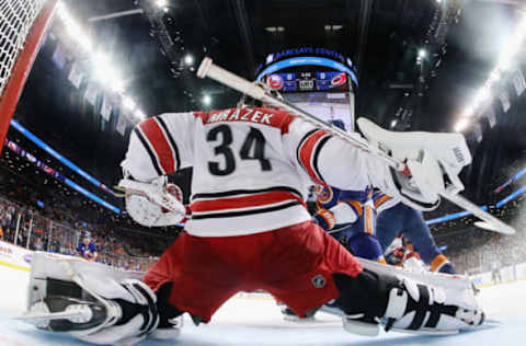 NEW YORK, NEW YORK – APRIL 26: Petr Mrazek #34 of the Carolina Hurricanes tends net against the New York Islanders in Game One of the Eastern Conference Second Round during the 2019 NHL Stanley Cup Playoffs at the Barclays Center on April 26, 2019 in the Brooklyn borough of New York City. (Photo by Bruce Bennett/Getty Images)