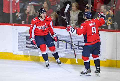 WASHINGTON, DC – NOVEMBER 7: Washington Capitals right wing T.J. Oshie (77) celebrates with defenseman Dmitry Orlov (9) after scoring the game winning goal against the Pittsburgh Penguins during third period action at Capital One Arena. (Photo by Jonathan Newton / The Washington Post via Getty Images)