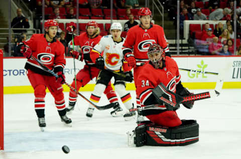 RALEIGH, NC – OCTOBER 29: Petr Mrazek #34 of the Carolina Hurricanes deflects the puck away from the crease during an NHL game against the Calgary Flames on October 29, 2019 at PNC Arena in Raleigh, North Carolina. (Photo by Gregg Forwerck/NHLI via Getty Images)