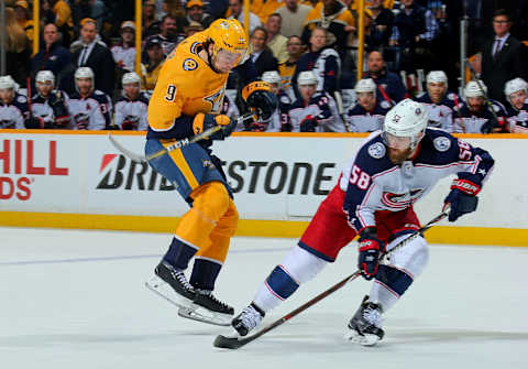 David Savard #58 of the Columbus Blue Jackets watches as Filip Forsberg #9 of the Nashville Predators  (Photo by Frederick Breedon/Getty Images)