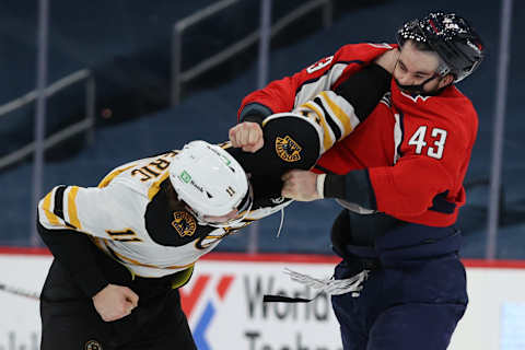 WASHINGTON, DC – FEBRUARY 01: Tom Wilson #43 of the Washington Capitals and Trent Frederic #11 of the Boston Bruins fight during the third period at Capital One Arena on February 01, 2021 in Washington, DC. (Photo by Patrick Smith/Getty Images)