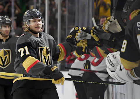 LAS VEGAS, NEVADA – MARCH 03: William Karlsson #71 of the Vegas Golden Knights celebrates with teammates on the bench after scoring a third-period goal, his 100th career NHL goal, against the New Jersey Devils during their game at T-Mobile Arena on March 3, 2020 in Las Vegas, Nevada. The Golden Knights defeated the Devils 3-0. (Photo by Ethan Miller/Getty Images)