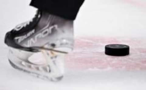 off Apr 17, 2023; Dallas, Texas, USA; A view of a NHL hockey puck and the red face-off circle during the game between the Dallas Stars and the Minnesota Wild in game one of the first round of the 2023 Stanley Cup Playoffs at the American Airlines Center. Mandatory Credit: Jerome Miron-USA TODAY Sports