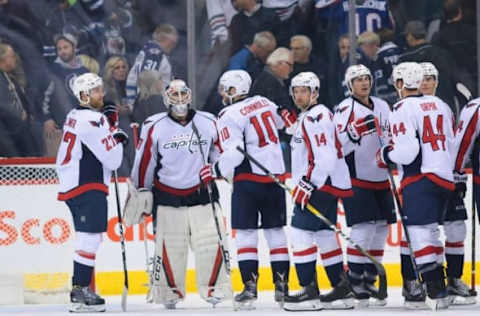 Nov 1, 2016; Winnipeg, Manitoba, CAN; Washington Capitals goalie Braden Holtby (70) celebrates with his teammates after the game against Winnipeg Jets at MTS Centre. Washington wins 3-2. Mandatory Credit: Bruce Fedyck-USA TODAY Sports