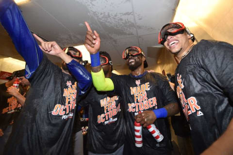 Oct 1, 2016; Philadelphia, PA, USA; The New York Mets celebrate in the clubhouse after clinching a wild-card playoff berth after a game against the Philadelphia Phillies at Citizens Bank Park. Mandatory Credit: Derik Hamilton-USA TODAY Sports