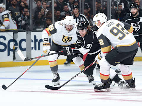 LOS ANGELES, CA – OCTOBER 13: Adrian Kempe #9 of the Los Angeles Kings races for the puck against William Carrier #28 and Tomas Nosek #92 of the Vegas Golden Knights during the first period of the game at STAPLES Center on October 13, 2019 in Los Angeles, California. (Photo by Juan Ocampo/NHLI via Getty Images)