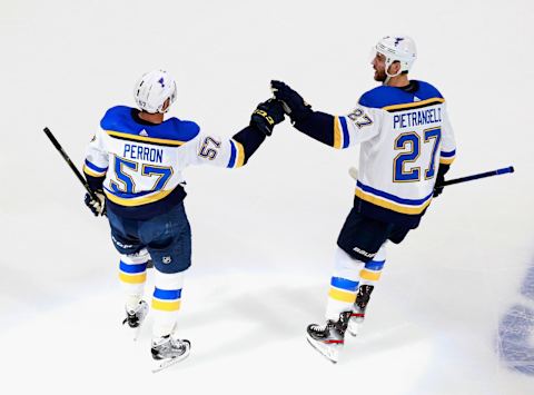 David Perron #57 of the St. Louis Blues celebrates his power-play goal at 16:46 of the first period against the Colorado Avalanche and is joined by Alex Pietrangelo #27 in a Round Robin game/ (Photo by Jeff Vinnick/Getty Images)