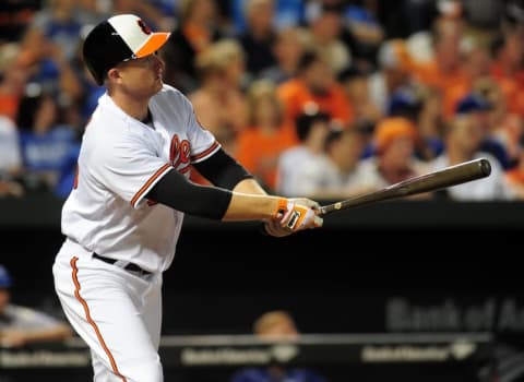 Jun 7, 2016; Baltimore, MD, USA; Baltimore Orioles designated hitter Mark Trumbo (45) hits a home run in the fifth inning against the Kansas City Royals at Oriole Park at Camden Yards. The Orioles won 9-1. Mandatory Credit: Evan Habeeb-USA TODAY Sports