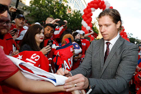 WASHINGTON, DC – OCTOBER 03: Nicklas Backstrom #19 of the Washington Capitals signs autographs on the red carpet before raising their 2018 Stanley Cup Championship banner prior to playing the Boston Bruins at Capital One Arena on October 3, 2018 in Washington, DC. (Photo by Patrick McDermott/NHLI via Getty Images)