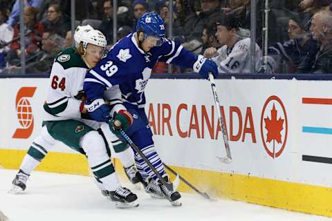 TORONTO, ON – MARCH 3: Toronto Maple Leafs right wing William Nylander (39) tries to control the puck behind the Wild net as Minnesota Wild center Mikael Granlund (64) checks him. Toronto Maple Leafs V Minnesota Wild during 3rd period action in NHL regular season play at the Air Canada Centre. Leafs lose 2-1. Toronto Star/Rick Madonik (Rick Madonik/Toronto Star via Getty Images)