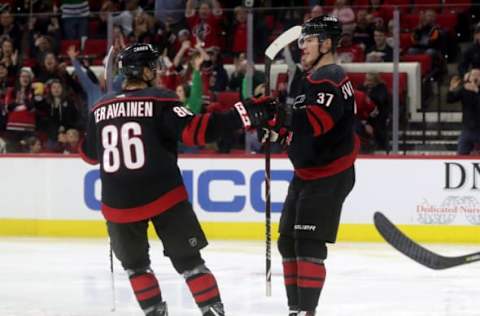 RALEIGH, NC – MARCH 16: Andrei Svechnikov #37 of the Carolina Hurricanes celebrates with teammate Teuvo Teravainen #86 after scoring a goal during an NHL game against the Buffalo Sabres on March 16, 2019, at PNC Arena in Raleigh, North Carolina. (Photo by Gregg Forwerck/NHLI via Getty Images)