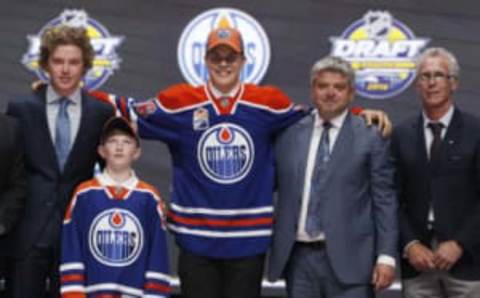 Jun 24, 2016; Buffalo, NY, USA; Jesse Puljujarvi poses for a photo after being selected as the number four overall draft pick by the Edmonton Oilers in the first round of the 2016 NHL Draft at the First Niagra Center. Mandatory Credit: Timothy T. Ludwig-USA TODAY Sports