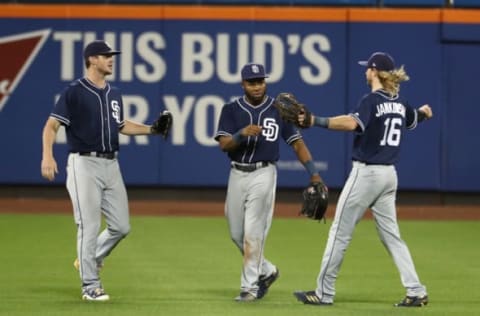 NEW YORK, NY – JULY 23: Wil Myers #4, Manuel Margot #7, and Travis Jankowski #16 of the San Diego Padres celebrate a 3-2 win against the New York Mets at Citi Field on July 23, 2018 in New York City. (Photo by Al Bello/Getty Images)