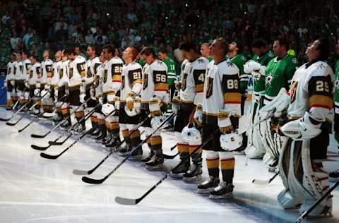 DALLAS, TX – OCTOBER 06: The Dallas Stars stand behind the Vegas Golden Knights on the ice during the National Anthem at American Airlines Center on October 6, 2017, in Dallas, Texas. (Photo by Tom Pennington/Getty Images)