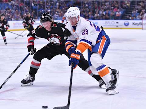 Oct 21, 2023; Buffalo, New York, USA; New York Islanders center Brock Nelson (29) and Buffalo Sabres defenseman Rasmus Dahlin (26) go for the puck in the first period at KeyBank Center. Mandatory Credit: Mark Konezny-USA TODAY Sports