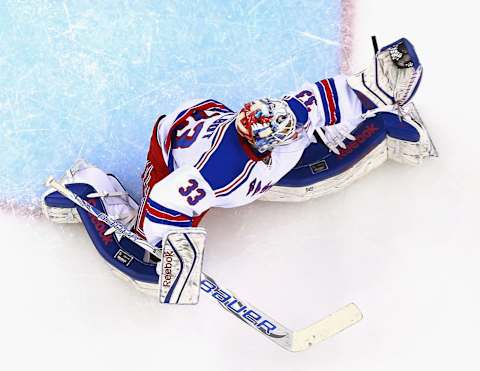 NEWARK, NJ – APRIL 07: Cam Talbot #33 of the New York Rangers makes a glove save against the New Jersey Devils during the game at the Prudential Center on April 7, 2015 in Newark, New Jersey. (Photo by Andy Marlin/NHLI via Getty Images)