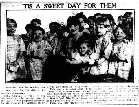 Actress Theda Bara giving candy to orphans in 1921.