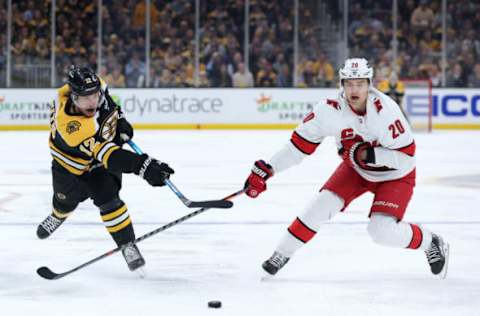 BOSTON, MASSACHUSETTS – MAY 06: Sebastian Aho #20 of the Carolina Hurricanes defends a shot from Craig Smith #12 of the Boston Bruins during the second period of Game Three of the First Round of the 2022 Stanley Cup Playoffs at TD Garden on May 06, 2022, in Boston, Massachusetts. (Photo by Maddie Meyer/Getty Images)