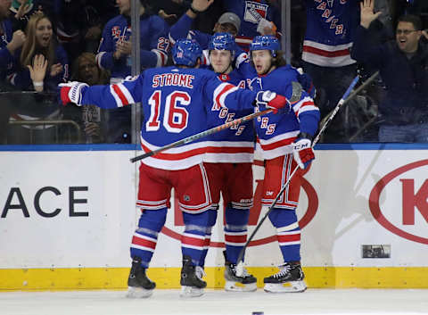 NEW YORK, NEW YORK – FEBRUARY 22: Jesper Fast #17 of the New York Rangers (C) celebrates his goal at 9:35 of the first period against the San Jose Sharks and is joined by Ryan Strome #16 (L) and Artemi Panarin #10 (R) at Madison Square Garden on February 22, 2020 in New York City. (Photo by Bruce Bennett/Getty Images)