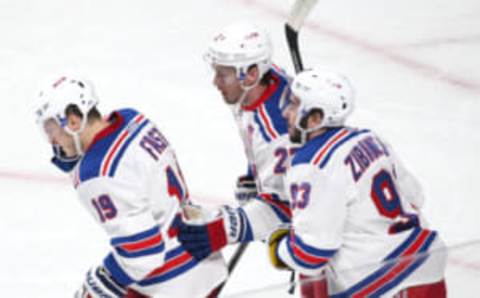 Apr 20, 2017; Montreal, Quebec, CAN; New York Rangers right wing Jesper Fast (19) celebrates his goal against Montreal Canadiens with teammates center Mika Zibanejad (93) and defenseman Ryan McDonagh (27) during the first period in game five of the first round of the 2017 Stanley Cup Playoffs at Bell Centre. Mandatory Credit: Jean-Yves Ahern-USA TODAY Sports