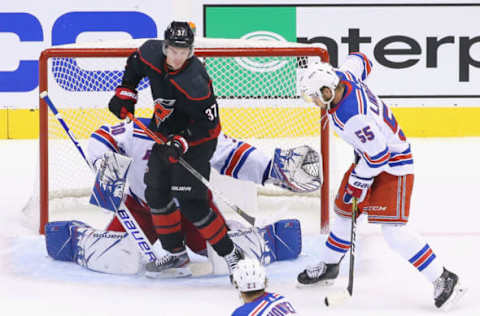 TORONTO, ONTARIO – AUGUST 01: Andrei Svechnikov #37 of the Carolina Hurricanes screens Henrik Lundqvist #30 of the New York Rangers during the second period of Game One of the Eastern Conference Qualification Round prior to the 2020 NHL Stanley Cup Playoffs at Scotiabank Arena on August 1, 2020, in Toronto, Ontario, Canada. (Photo by Andre Ringuette/Getty Images)