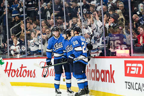 Winnipeg Jets forward Jansen Harkins (58), Patrik Laine (29), Jack Roslovic (28) Mandatory Credit: Terrence Lee-USA TODAY Sports