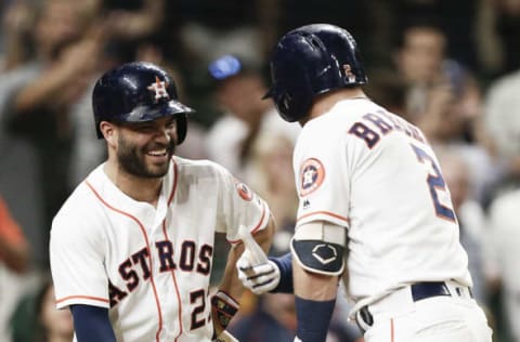 HOUSTON, TX – JULY 10: Alex Bregman #2 of the Houston Astros celebrates with Jose Altuve #27 after hitting a home run in the seventh inning against the Oakland Athletics at Minute Maid Park on July 10, 2018 in Houston, Texas. (Photo by Bob Levey/Getty Images)