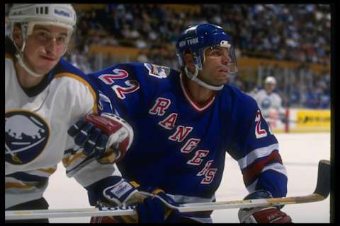 15 Oct 1993: Rightwinger Mike Gartner of the New York Rangers (right) works against the Buffalo Sabres during a game at Memorial Auditorium in Buffalo, New York. Mandatory Credit: Rick Stewart /Allsport