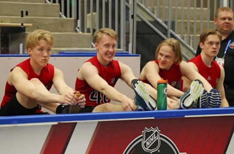 BUFFALO, NY – JUNE 1: Simon Holmstrom, Lassi Thomson, Anttoni Honka and Graeme Clarke (pictured left to right) stretch prior to their testing during the 2019 NHL Scouting Combine on June 1, 2019 at Harborcenter in Buffalo, New York. (Photo by Bill Wippert/NHLI via Getty Images)