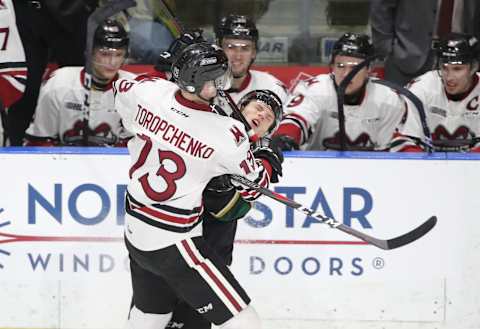 LONDON, ON – FEBRUARY 26: Alexey Toropchenko #13 of the Guelph Storm hits William Lochead #4 of the London Knights in the second period during OHL game action at Budweiser Gardens on February 26, 2019 in London, Canada. (Photo by Tom Szczerbowski/Getty Images)