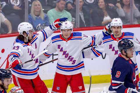 WINNIPEG, MB – FEBRUARY 11: Mika Zibanejad #93, Ryan Strome #16 and Chris Kreider #20 of the New York Rangers celebrate a second period goal against the Winnipeg Jets at the Bell MTS Place on February 11, 2020 in Winnipeg, Manitoba, Canada. (Photo by Darcy Finley/NHLI via Getty Images)