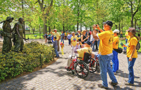 A group of veterans visit the Vietnam memorial in Washington D.C.