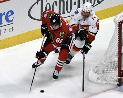 Nov 1, 2016; Chicago, IL, USA; Chicago Blackhawks right wing Patrick Kane (88) is defended by Calgary Flames defenseman Dennis Wideman (6) during the first period at the United Center. Mandatory Credit: David Banks-USA TODAY Sports