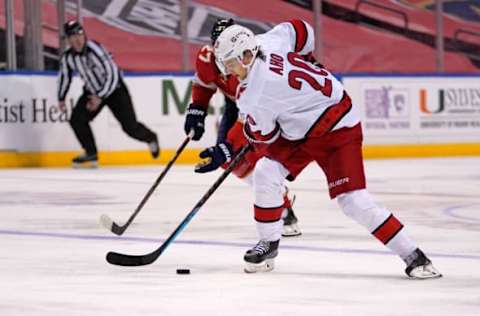 Mar 1, 2021; Sunrise, Florida, USA; Carolina Hurricanes right wing Sebastian Aho (20) controls the puck against the Florida Panthers during the first period at BB&T Center. Mandatory Credit: Jasen Vinlove-USA TODAY Sports