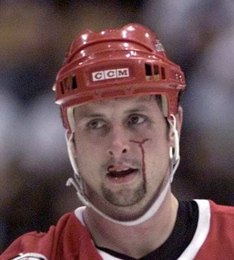 WEIL06-11/08/00-Carolinas Dave Karpa leaves the ice after a scrap with Leafs Shayne Corson during NHL action between the Toronto Maple Leafs and the Carolina Hurricanes, Wednesday November 8, 2000, at the Air Canada Centre, Toronto. (BERNARD WEIL/TORONTO STAR) DIGITAL IMAGE (Photo by Bernard Weil/Toronto Star via Getty Images)