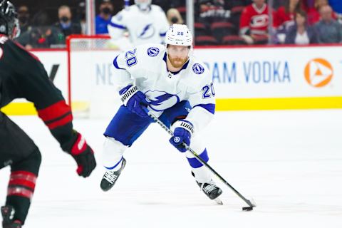 Jun 1, 2021; Raleigh, North Carolina, USA; Tampa Bay Lightning center Blake Coleman (20) skates with the puck against the Carolina Hurricanes in game two of the second round of the 2021 Stanley Cup Playoffs at PNC Arena. Mandatory Credit: James Guillory-USA TODAY Sports