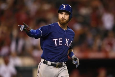 Sep 10, 2016; Anaheim, CA, USA; Texas Rangers catcher Jonathan Lucroy (25) points to the dugout after hitting a two-run home run against the Los Angeles Angels during the eighth inning at Angel Stadium of Anaheim. Mandatory Credit: Kelvin Kuo-USA TODAY Sports