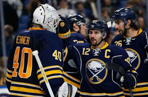 NHL Power Rankings: Buffalo Sabres goalie Robin Lehner (40) is congratulated by right wing Brian Gionta (12) after winning the game against the Los Angeles Kings at KeyBank Center. Sabres beat the Kings 6-3. Mandatory Credit: Kevin Hoffman-USA TODAY Sports