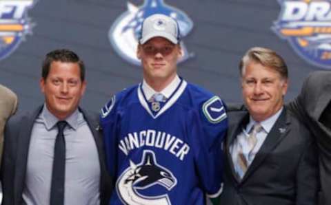 Jun 24, 2016; Buffalo, NY, USA; Olli Juolevi poses for a photo after being selected as the number five overall draft pick by the Vancouver Canucks in the first round of the 2016 NHL Draft at the First Niagra Center. Mandatory Credit: Timothy T. Ludwig-USA TODAY Sports