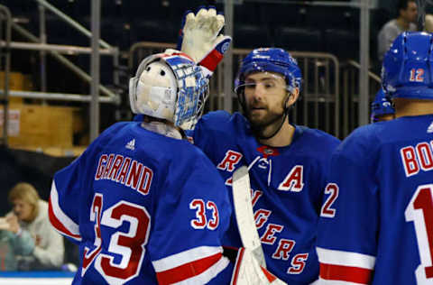 NEW YORK, NEW YORK – SEPTEMBER 26: Dylan Garand #33 and Barclay Goodrow #21 of New York Rangers celebrate a 4-2 win over the New York Islanders during a preseason game at Madison Square Garden on September 26, 2023, in New York City. (Photo by Bruce Bennett/Getty Images)