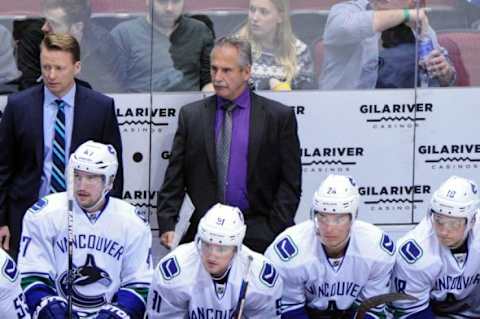 Feb 10, 2016; Glendale, AZ, USA; Vancouver Canucks head coach Willie Desjardins looks on during the first period against the Arizona Coyotes at Gila River Arena. Mandatory Credit: Matt Kartozian-USA TODAY Sports