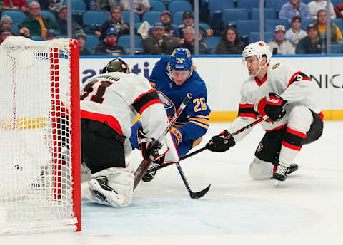 BUFFALO, NY – FEBRUARY 17: Anton Forsberg #31 of the Ottawa Senators makes the save against Rasmus Dahlin #26 of the Buffalo Sabres as Josh Brown #3 defends during the third period at KeyBank Center on February 17, 2022 in Buffalo, New York. (Photo by Kevin Hoffman/Getty Images)