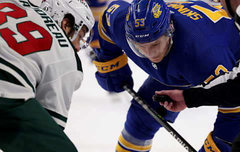 Mar 4, 2022; Buffalo, New York, USA; Minnesota Wild center Frederick Gaudreau (89) and Buffalo Sabres left wing Jeff Skinner (53) wait for the face-off during the second period at KeyBank Center. Mandatory Credit: Timothy T. Ludwig-USA TODAY Sports