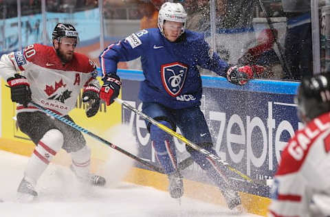 ST. PETERSBURG, RUSSIA. MAY 16, 2016. Canada’s Ryan O Reilly (L) and France’s Yohann Auvitu fight for the puck in their 2016 IIHF World Championship Preliminary Round Group B ice hockey match at Yubileyny Sports Palace. The Canadian Team won the game 4:0. Sergei Savostyanov/TASS (Photo by Sergei SavostyanovTASS via Getty Images)