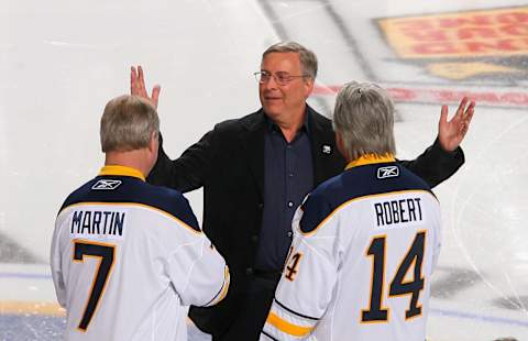 BUFFALO, NY – FEBRUARY 23: New Buffalo Sabres owner Terry Pegula reacts as former Sabres palyers Rene Robert #14 and Rick Martin #7 skate out to meet him during pre game ceremonies prior to play against the Atlanta Thrashers at HSBC Arena on February 23, 2011 in Buffalo, New York. (Photo by Rick Stewart/Getty Images)