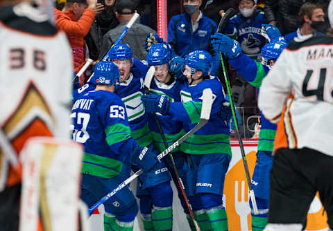 Nov 9, 2021; Vancouver, British Columbia, CAN; Vancouver Canucks forward Bo Horvat (53), forward J.T. Miller (9), forward Elias Pettersson (40) and defenseman Quinn Hughes (43) celebrate Pettersson’s goal against the Anaheim Ducks in the third period at Rogers Arena. Ducks won 3-2 in Overtime. Mandatory Credit: Bob Frid-USA TODAY Sports